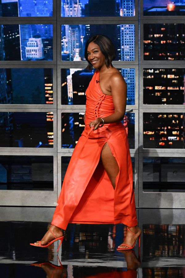 Wardrobe Breakdown: Tiffany Haddish One-Shoulder Orange Midi Dress On Stephen Colbert
